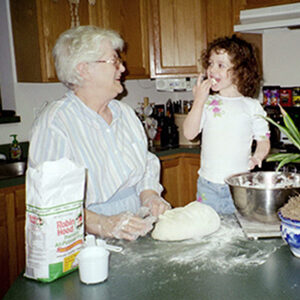 Sara learning to make bread from Granny